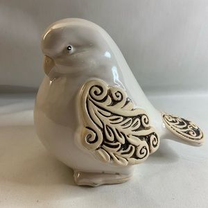 Ceramic Dove figurine with white glaze. Scrollwork on wings and tail feathers